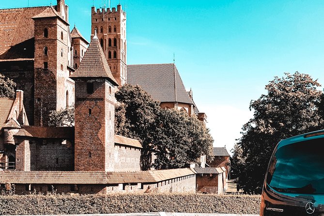 Malbork Castle regular tour - Guide setup and hearing in a huge stone complex